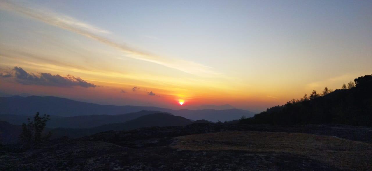 Sunset over hills from Galimale Homestay private viewpoint